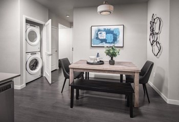 Dining area with view to washer and dryer